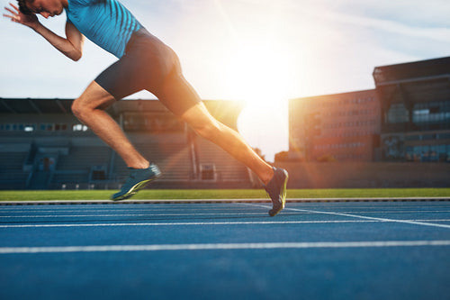 Runner practicing in athletics stadium