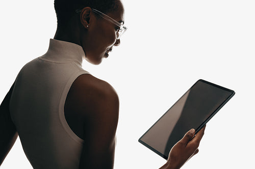 Professional woman holding a tablet device for modern digital technology use