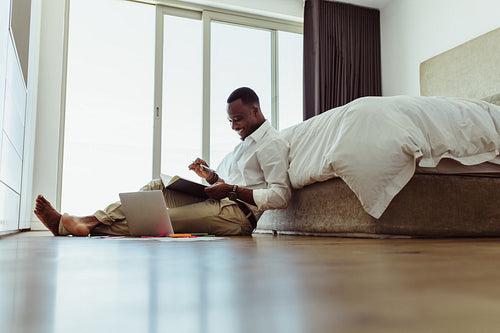 Man working on laptop sitting at home