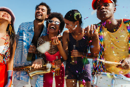 Friends celebrate at a colorful beach party