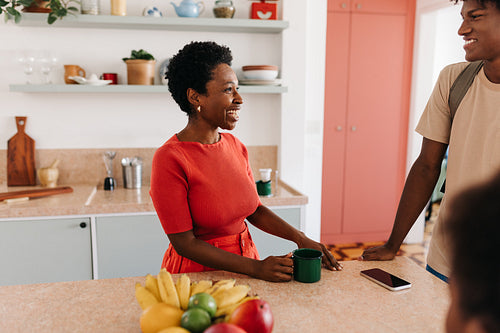 Morning routine: Mom and son preparing breakfast together