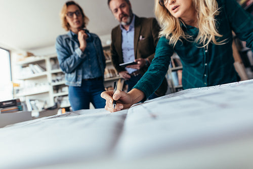 Team of architects working on construction plan
