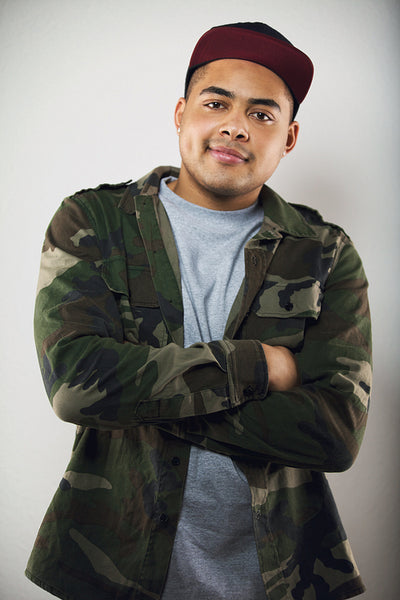 Stylish young male guy posing with arms crossed