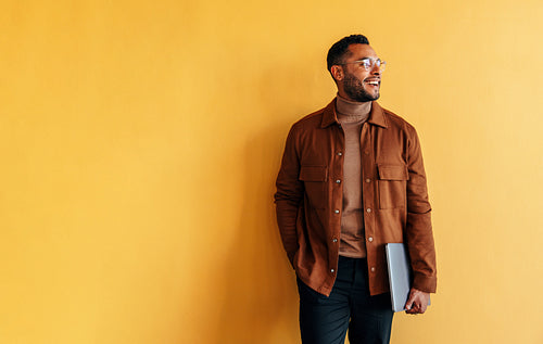 Creative businessman looking away with a smile 