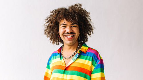 Gay man smiling in a studio
