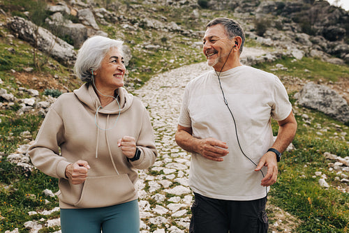 Happy senior couple working out together outdoors