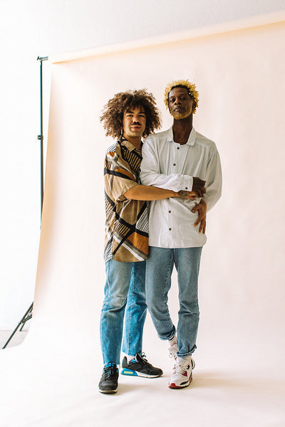 Affectionate male lovers embracing each other in studio