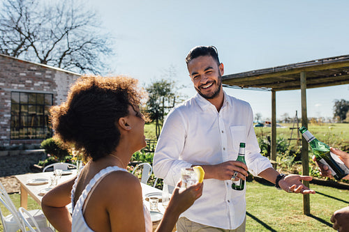 Man having a party with friends in garden