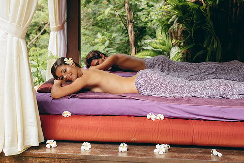 Couple lying on a massage table
