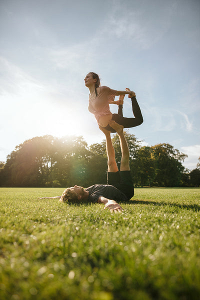 Couple doing acroyoga workout