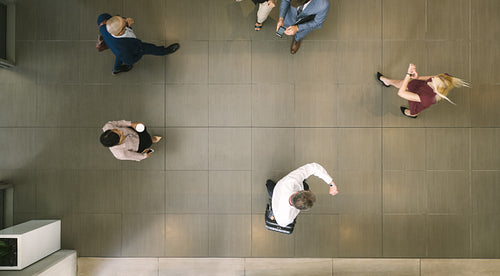 People walking through a hallway
