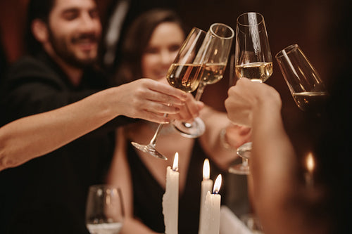 Friends celebrating new years party with drinks