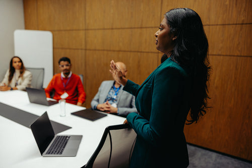 Successful Indian executive leading a business meeting