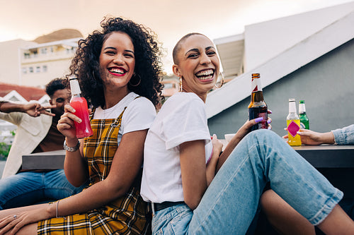 Friends enjoying cold drinks outdoors