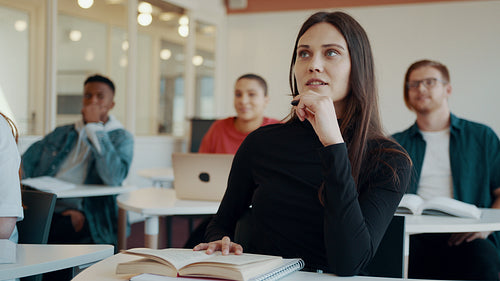 Girl getting guidance from the teacher in classroom