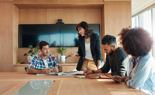 Creative team of professionals meeting in conference room