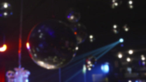 Mirror balls in nightclub shot with blur effect.