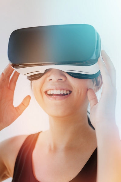 Smiling woman using the virtual reality headset