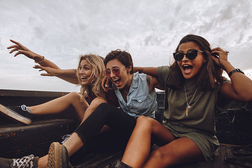 Excited friends having fun on rod trip