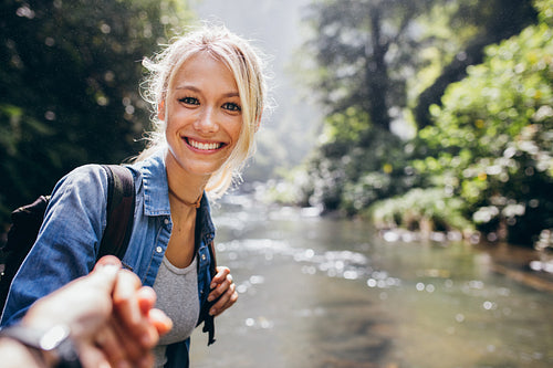 Woman enjoying a hike in nature with her boyfriend