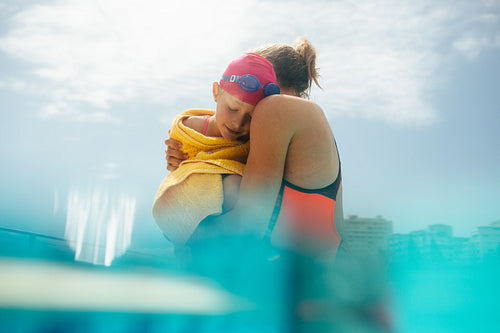 Mother and daughter in the pool