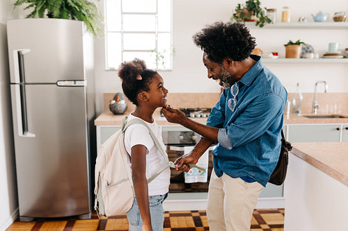 Happy father and daughter start their day with a morning routine