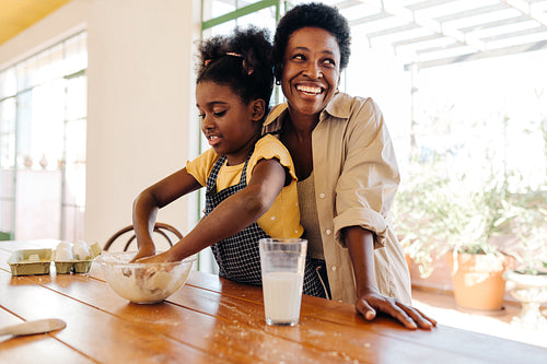Family baking Brazilian cheese bread: Mother-daughter kitchen fun!
