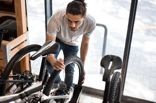 Man in a bicycle workshop
