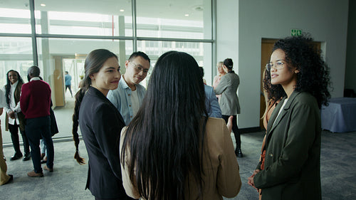 Business professionals engaging in conversation