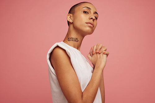 Androgynous woman staring at camera.