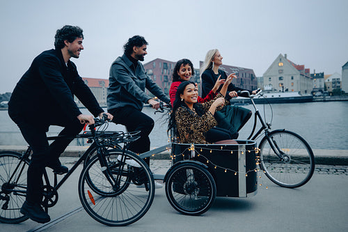 Friends enjoying a fun bike ride together in a scenic urban setting