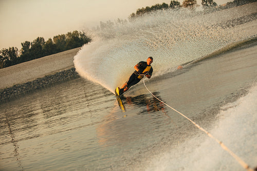 Man water skiing on lake