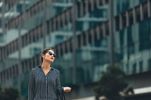Business woman in front of urban building