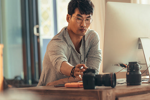 Photographer at his work desk