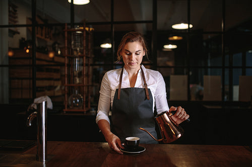 Female barista preparing coffee