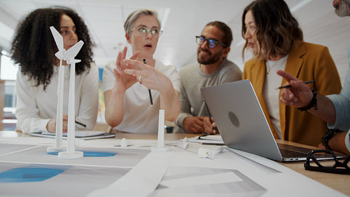 Business team having a meeting on a wind turbine design project