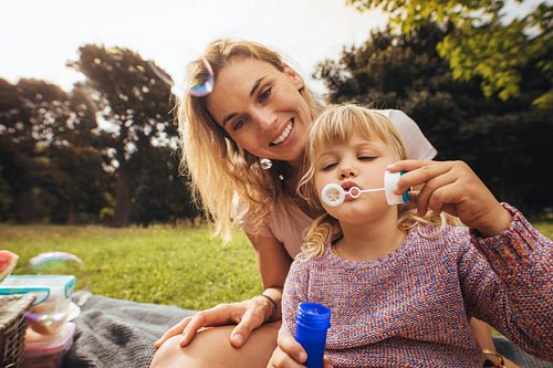 Mother and daughter on a picnic at park