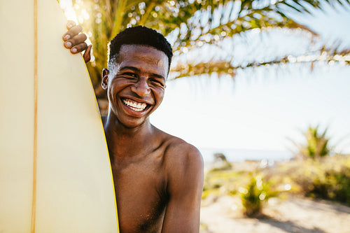 Smiling young surfer