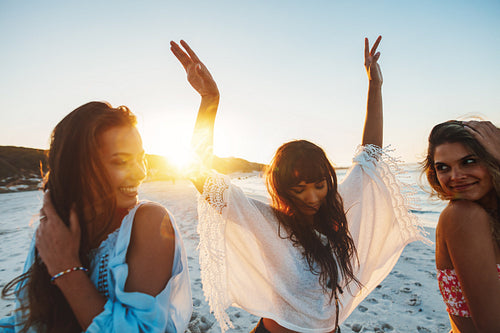 Three young woman having fun on beach