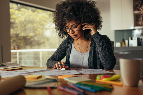 Female architect talking over phone