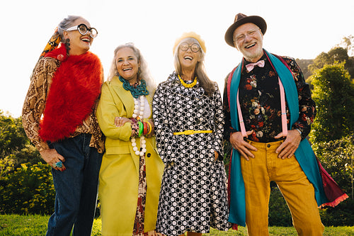 Happy elderly people laughing in a park