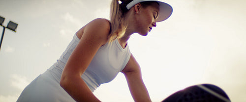 Young people enjoying an active game of padel on a sunny outdoor court