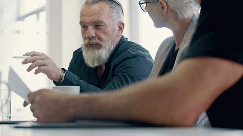 Businessman discussing project details with colleagues
