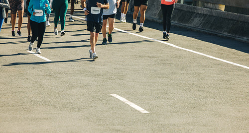 Runners participating in a marathon with ample space for adding copy