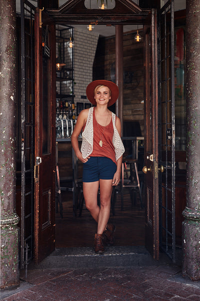 Attractive young woman leaving a cafe