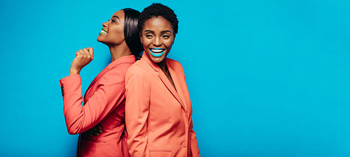 Fashion models in stylish clothing and vibrant makeup