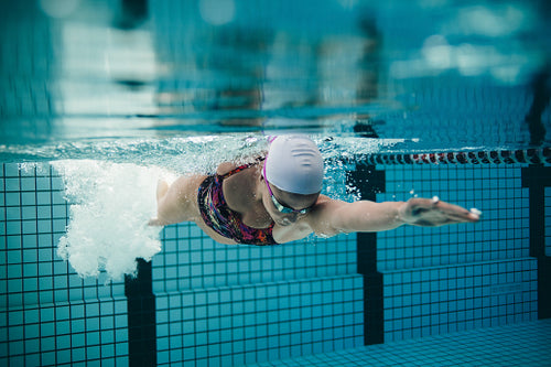 Female athlete swimming in pool