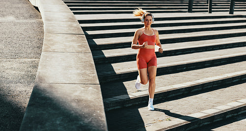 Female runner burning calories with a cardio workout