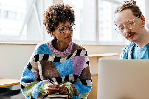 Colleagues collaborating in a bright freelance co-working space