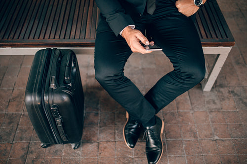 Businessman waiting at public transportation station